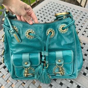 Turquoise Isabella Fiore purse.
